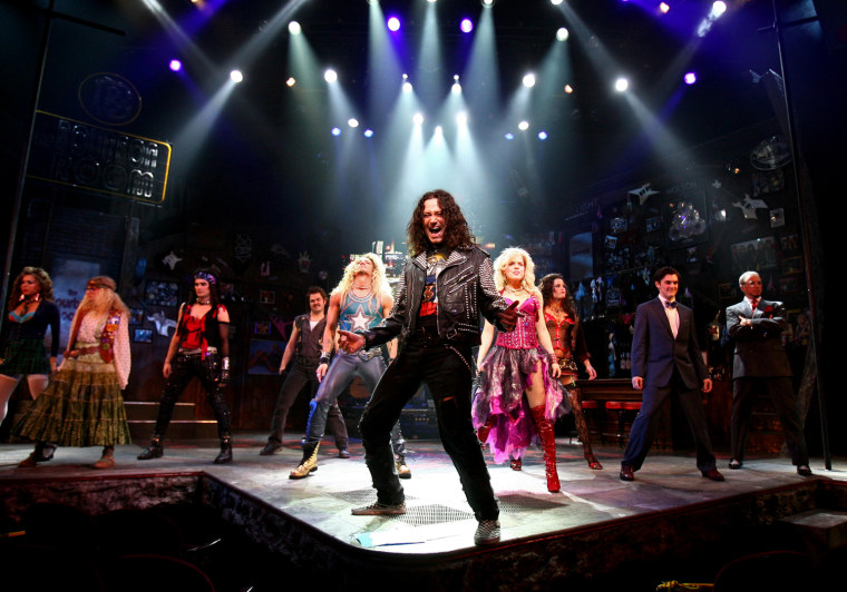 In this theater publicity image released by Barlow Hartman Public Relations, Constantine Maroulis, center, performs with the rest of the company in the musical, \"Rock of Ages,\" in New York. (AP Photo/Barlow Hartman Public Relations, Joan Marcus) ** NO SALES **