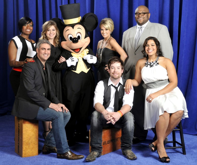 In a photo provided by Disney, for the first time all seven winners of \"American Idol\" gather around Mickey Mouse Thursday  Feb. 12, 2009 at Disney's Hollywood Studios theme park for the opening of The American Idol Experience at Walt Disney World Resort in Lake Buena Vista, Fla.  Clockwise, from front left are,  Taylor Hicks, Fantasia Barrino, Kelly Clarkson, Mickey Mouse, Carrie Underwood, Ruben Studdard, Jordin Sparks and David Cook.  The American Idol Experience attraction, inspired by the hit TV show, lets Disney park guests audition with a chance to appear on-stage, or vote on their favorite singing performances from the audience.  (AP Photo/Garth Vaughan/Disney)