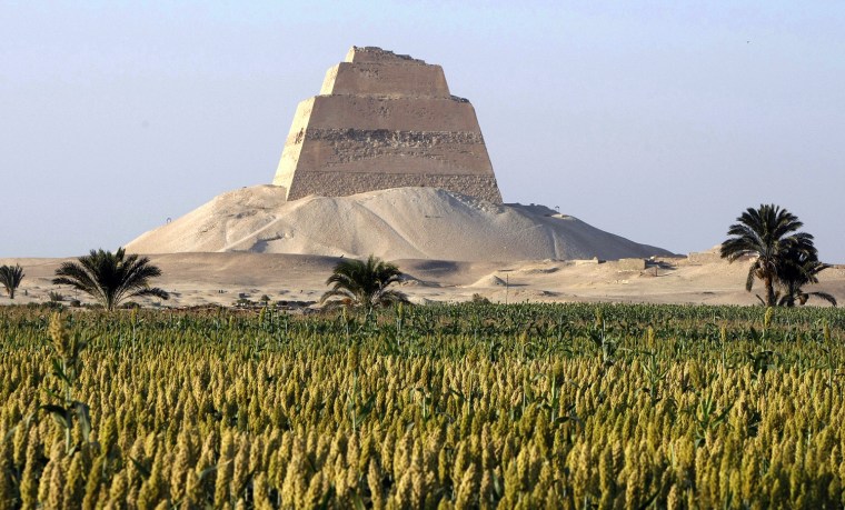 The Maidum pyramid stands on the desert'