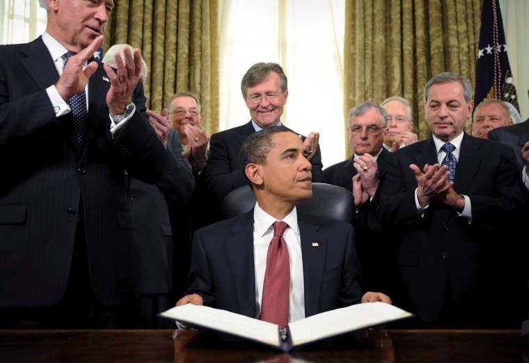U.S. President Barack Obama signs orders to close Guantanamo Bay