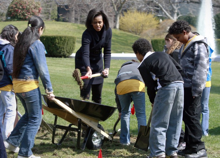 U.S. first lady Michelle Obama joins 5th grade students during a groundbreaking ceremony for the new White House Kitchen Garden in Washington