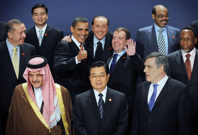 At center, US President Barack Obama, Italy's Prime Minister Silvio Berlusconi, and Russa's President Dmitry Medvedev, react as they take part in a group photo to mark the G20 summit in London, Thursday, April 2, 2009.  Others in the group in the front row are Saudi Foreign Minister, Prince Saud Al-Faisal; China's President, Hu Jintao and Britain's \prime Minister,Gordon Brown.  Center left is Turkey's Prime Minister Recep Tayyip Erdogan, Thailand's Prime Minister, Abhisit Vejjajiva is seen top left. At right is South Africa's President, Kgalema Motlanthe while at top right is Ethiopia's Prime Minister, Meles Zenawi.   (AP Photo/Stefan Rousseau/PA)  **  UNITED KINGDOM OUT NO SALES NO ARCHIVE  **