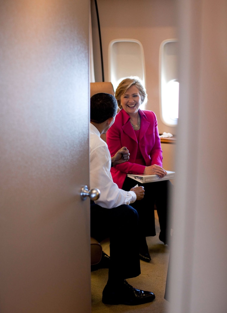 President Barack Obama is seen speaking with U.S. Secretary of State Hillary Rodham Clinton aboard Air Force One, on their way to Strasbourg, France, April 3, 2009. White House Photo/Pete Souza