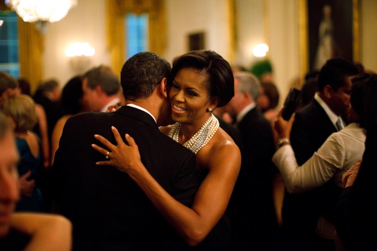 President Barack Obama and First Lady Michelle Obama dance while the band Earth, Wind and Fire performs at the Governors Ball in the State Dining Room of the White House 2/22/09. 
Official White House Photo by Pete Souza