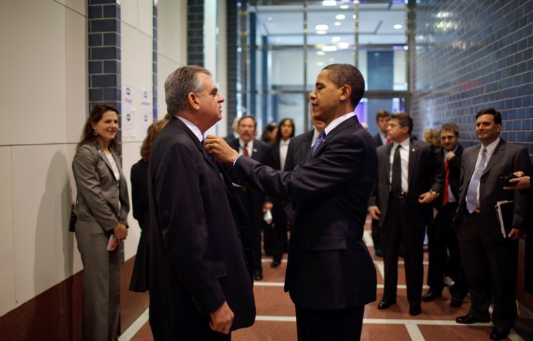 President Barack Obama fixes the tie of Secretary Ray LaHood, as they prepare for an announcement at the Department of Transportation, Washington, D.C. 3/3/09
Official White House Photo by Pete Souza