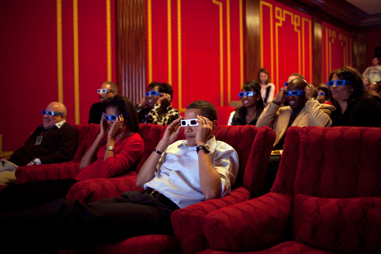 President Barack Obama and First Lady Michelle Obama wear 3-D glasses while watching Super Bowl 43, Arizona Cardinals vs. Pittsburgh Steelers, at a Super Bowl Party in the family theater of the White House. Guests included family,  friends, staff members and bipartisan members of Congress, 2/1/09. 
Official White House Photo by Pete Souza