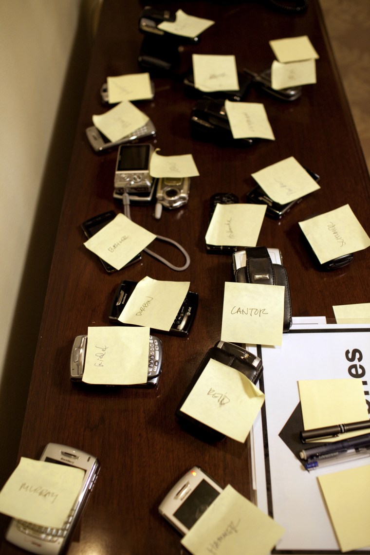Blackberrys, cell phones and communications devices are tagged with post-its during a briefing on Afghanistan and Pakistan in the Cabinet Room 3/26/09. Official White House Photo by Pete Souza