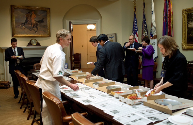 White House staff  join a pizza tasting gathering April 10, 2009, in the Roosevelt Room at the White House.  Official White House Photo by Pete Souza