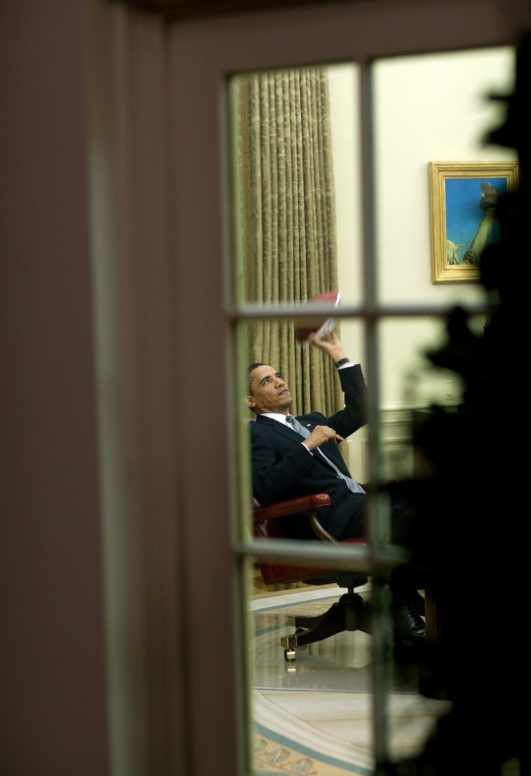President Barack Obama plays with a football in the Oval Office 
4/23/09. 
Official White House Photo by Pete Souza