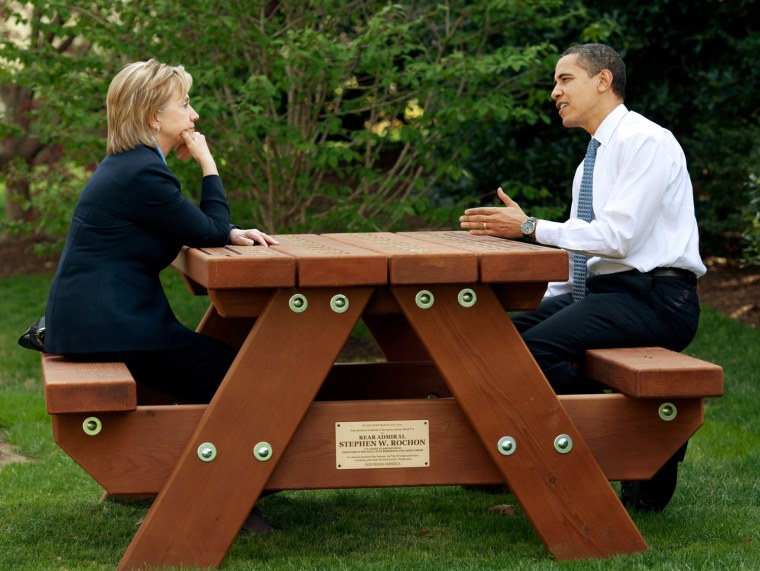President Barack Obama and Secretary of State Hillary Rodham Clinton speak together sitting at a picnic table April 9, 2009, on the South Lawn of the White House. Official White House Photo by Pete Souza