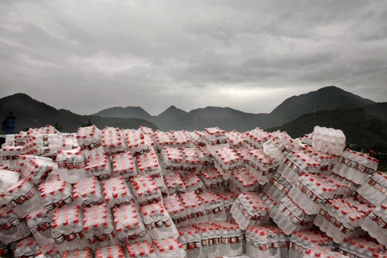 Bottles of water pile up at a refugee camp for earthquake survivors who lost their houses following May 12 earthquake in Leigu near the town of Beichuan, southwest China's Sichuan Province Thursday, May 29, 2008. (AP Photo/Oded Balilty)