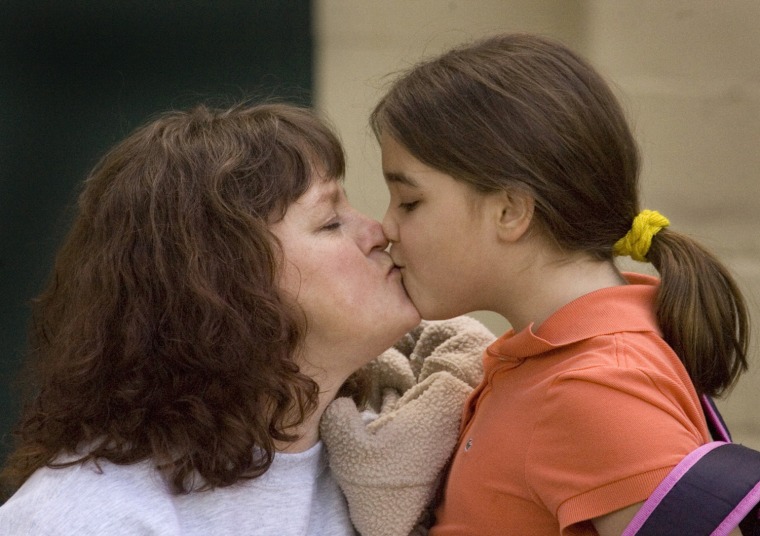 ** ADVANCE FOR WEEKEND EDITIONS, MAY 9-10 **In this  March 3, 2009 photo, Brehanna Ledesma, 9, kisses her mother, Heidi Ledesma, outside a homeles day shelter in Portland, Ore.  The Ledesma's were evicted and became homeless last December after Joe lost his homebuilder job.(AP Photo/Don Ryan)