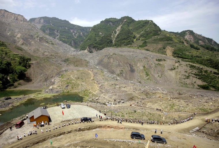Image: Students who are earthquake survivors visit the Donghekou Earthquake Site Park in Qingchuan County
