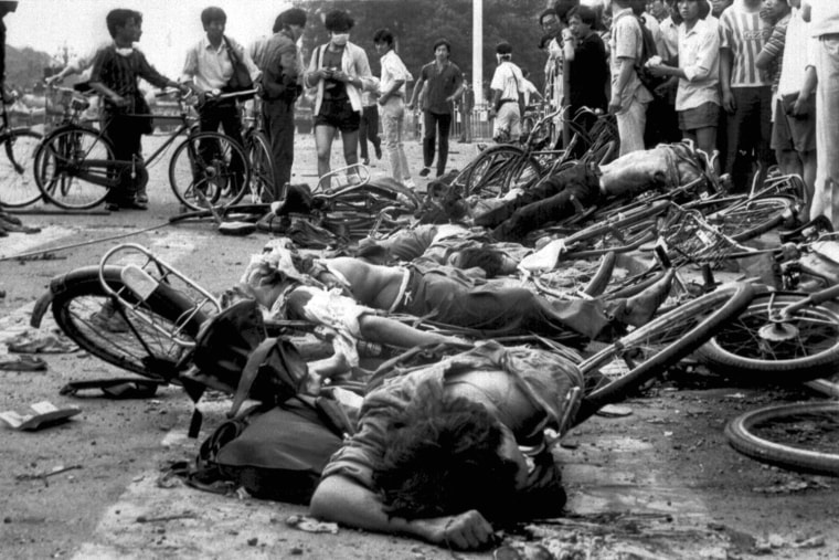 ** FILE ** The bodies of dead civilians lie among mangled bicycles near Beijing's Tiananmen Square in this June 4, 1989 file photo.  A candlelight vigil held annually in Hong Kong to mark the anniversary of the bloody crackdown on Tiananmen Square protests is expected to draw a larger than usual crowd in 2007, thanks to an unlikely source: a pro-Beijing lawmaker. (AP Photo/File)