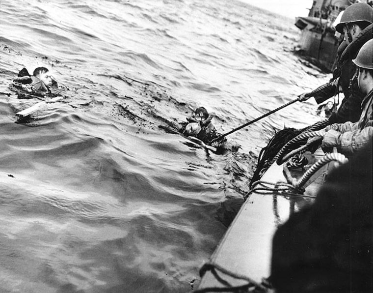 Coast Guardsmen rescue survivors off Normandy, June 1944.