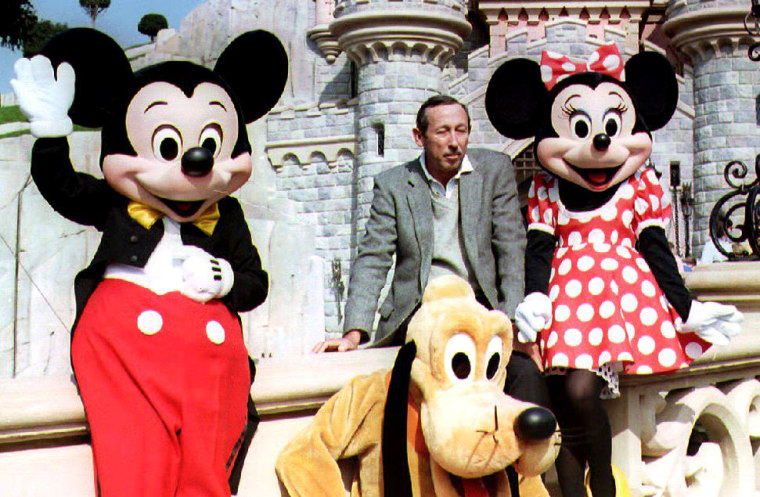 Image: Roy Disney, son of Walt Disney, poses with Mickey,