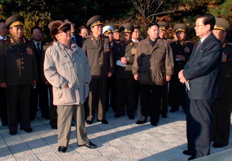 Image: North Korean leader Kim Jong-il and his youngest son Kim Jong-un visit the cemetery for Chinese soldiers who died during the 1950-53 Korean War in Hoechang County, North Korea in this picture released by North Korea's official KCNA news agency.