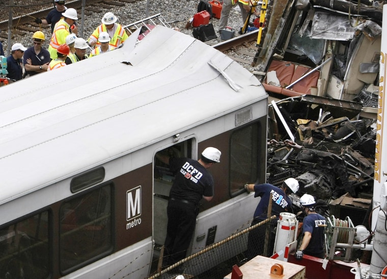 Image: Federal and local investigators examine the wreckage of a train which collided with another train in Washington,