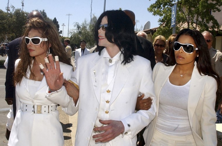 File photo of Michael Jackson and sisters LaToya and Janet Jackson walking over to greet fans during a lunch break at a pretrial hearing in Santa Maria