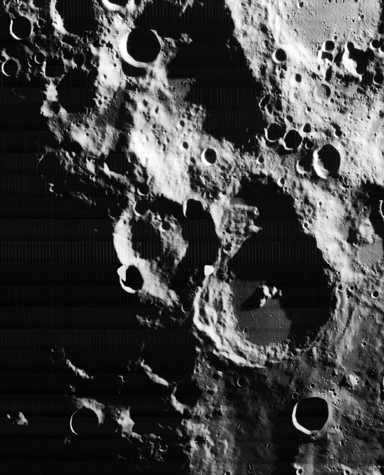 This image was taken by Lunar Orbiter IV in May 1967 and shows the south pole of the Moon. Figure 1 shows the region without labels. Figure 2 shows major features plus notation regarding processing artifacts from the spacecraft's film processing system. The moon's south pole is located near the rim of Shackleton Crater <http://en.wikipedia.org/wiki/Shackleton_(crater)>. 
Adjacent to the south pole is Shoemaker crater <http://en.wikipedia.org/wiki/Shoemaker_(lunar_crater)> named in honor of famed planetary geologist Eugene Shoemaker <http://en.wikipedia.org/wiki/Eugene_Shoemaker>. The Lunar Prospector <http://en.wikipedia.org/wiki/Lunar_Prospector> spacecraft, carrying some of Shoemaker's ashes, was deliberately crashed in this crater in an attempt to see if any water ice would be thrown up by the impact.
The Lunar CRater Observation and Sensing Satellite <http://lcross.arc.nasa.gov/> (LCROSS) will be targeted to impact at the south pole of the moon. As such, the moon's polar regions are of great inter