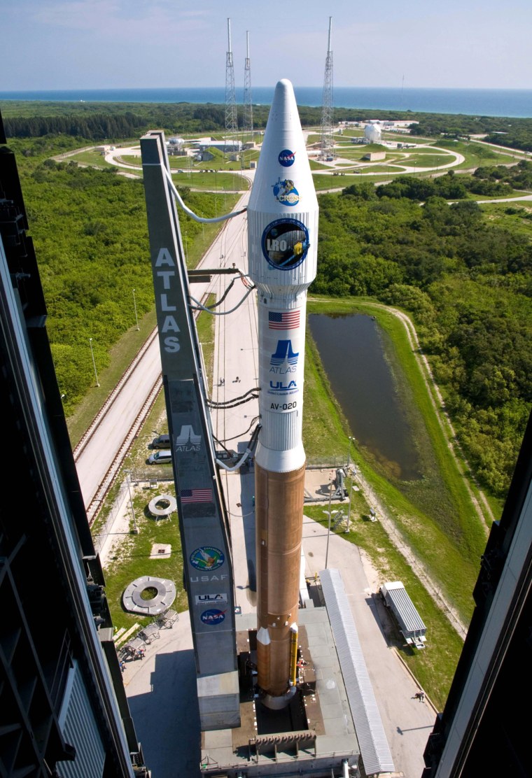This NASA handout photo shows NASA's Lunar Reconnaissance Orbiter, or LRO, and Lunar Crater Observation and Sensing Satellite, or LCROSS, rolled aboard their Atlas V rocket to the launch pad at Cape Canaveral Air Force Station in Florida in preparation for launch. NASA is set to blast off probes June 18, 2009 on a landmark lunar exploration mission to scout water sources and landing sites in anticipation of leading man back to the moon.The US space agency, hoping to send astronauts to Earth's natural satellite by 2020 for the first visit since 1972, announced it is on course to launch the dual LRO and LCROSS missions atop an Atlas V rocket from Florida's Kennedy Space Center. A day after scrubbing the shuttle Endeavour launch for the second time in a week because of a nagging hydrogen fuel leak, NASA said it has three launch windows ready at 5:12 pm (2112 GMT), 5:22 pm (2122 GMT) and 5:32 pm (2132 GMT). (Photo credit should read HO/AFP/Getty Images)