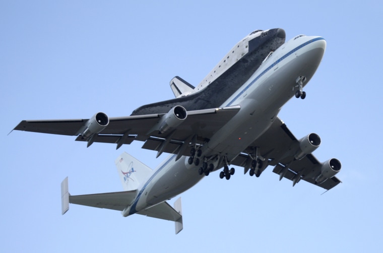 After a flight from Edwards Air Force Base space shuttle Atlantis returns to Kennedy Space Center aboard a NASA 747 in Cape Canaveral, Fla., Tuesday, June 2, 2009. (AP Photo/John Raoux)