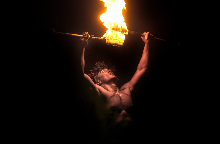 Brandon ÒFueÓ Maneafaiga, balances two flaming knifes during the 13th Annual World Fireknife Championship at the Polynesian Cultural Centre in Laie, Hawaii