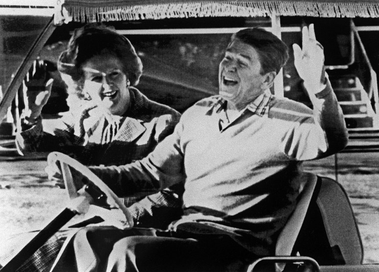 Ronald Reagan (R) and Margaret Thatcher wave after