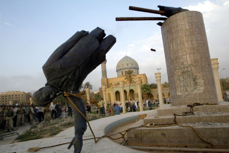 A STATUE OF PRESIDENT SADDAM HUSSEIN FALLS IN CENTRAL BAGHDAD