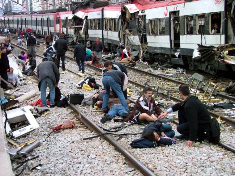 VICTIMS TENDED TO BY RESCUE WORKERS AFTER TRAIN EXPLOSION IN MADRID
