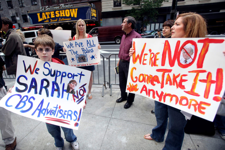 Susan Wynalek, right, of Coltsneck, N.J., her daughter Stephanie, center and son Brett  participate in a \"Fire David Letterman\" rally to protest his jokes about Sarah Palin and her family across from the Ed Sullivan Theater, Tuesday, June 16, 2009 in New York.  (AP Photo/Mary Altaffer)