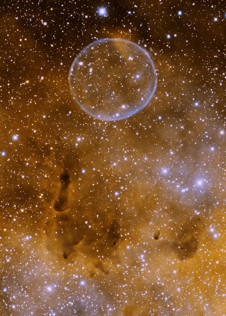 Informally known as the \"Soap Bubble Nebula\", this planetary nebula (officially known as PN G75.5.7) was discovered by amateur astronomer Dave Jurasevich on July 6th, 2008. It was noted and reported by Keith Quattrocchi and Mel Helm on July 17th, 2008. This image was obtained with the Kitt Peak Mayall 4-meter telescope on June 19th, 2009 in the H-alpha (orange) and [OIII] (blue) narrowband filters. In this image, north is to the left and east is down.

PN G75.5.7 is located in the constellation of Cygnus, not far from the Crescent Nebula (NGC 6888). It is embedded in a diffuse nebula which, in conjunction with its faintness, is the reason it was not discovered until recently. The spherical symmetry of the shell is remarkable, making it very similar to Abell 39.