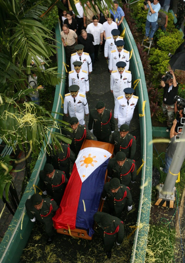 Image: Philippine military carry the coffin of the late Philippine President Cory Aquino in Mandaluyong City