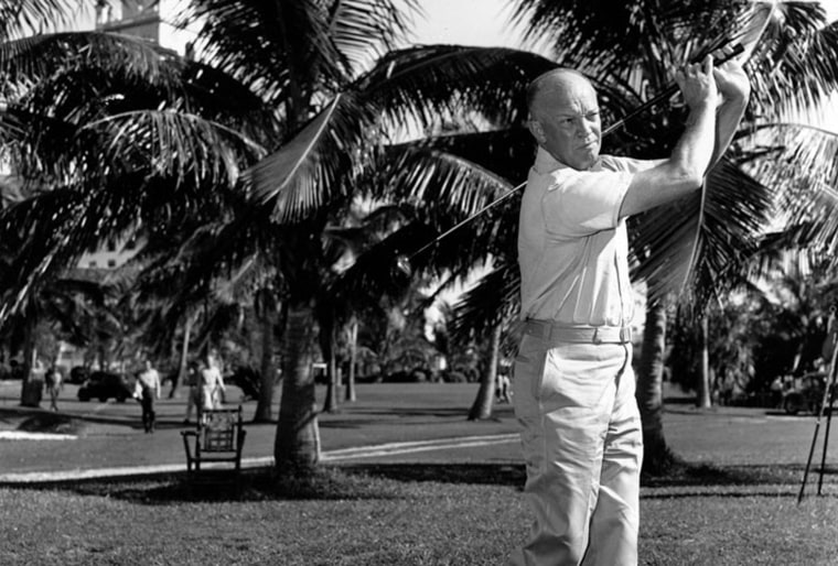 Dwight D. Eisenhower relaxes at the 18th hole during a golf game in Newport, R.I., Sept. 10, 1957. (AP Photo/Henry Burroughs)