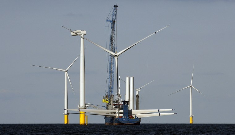Image: Blades of a wind turbine are lifted by a crane at Horns Rev 2 near Esbjerg