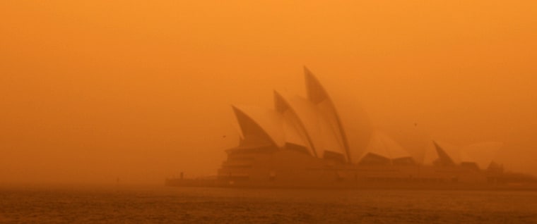 Image: A dust storm blankets Sydney's iconic Opera House at sunrise