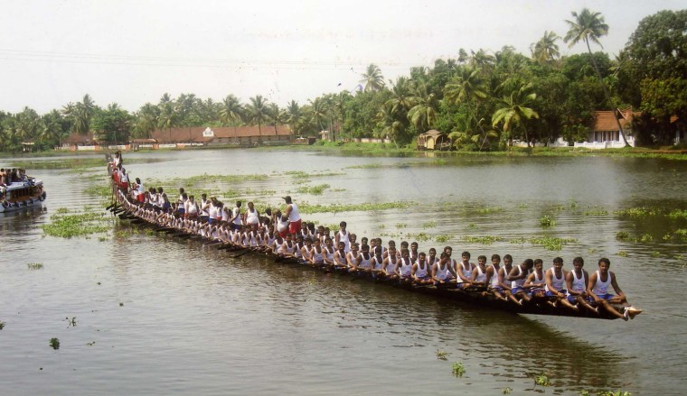 The `Snake Boat' Aries Punnamada Urukku Chundan, measuring 43.7 m (143 ft 4 in) long from Alleppey, Kerala, India, had a crew of 143 which included 118 rowers, 2 rhythm men, 5 helmsmen and 18 singers and was rowed in public in Kerala, India, on 1 May 2008.