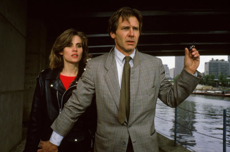 Roman Polanski's FRANTIC is an engaging thriller in the tradition of Alfred Hitchcock. Harrison Ford plays Richard Walker, an American heart surgeon vacationing with his wife, Sondra (Betty Buckley), in Paris, where he is to attend a medical convention. Sondra suddenly and unexpectedly disappears from the couple's hotel room while Richard is taking a shower, and when she doesn't return after several hours, he decides to report the incident. But neither the French police nor the U.S. embassy offers much help or even appears particularly interested in his dilemma. On the brink of despair, Walker decides to embark on an investigation himself, aided by Michelle (Emmanuelle Seigner), a carefree, seductive gamine who is also mixed up in the case, as he discovers after tracing back to her a mysterious piece of switched luggage that he suspects his wife's kidnappers are after. When the mismatched duo finally succeed in tracking down the perpetrators, it becomes apparent that the stakes in this extortion schem