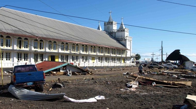 Image: Debris is strewn around a church in Leone, American Samoa