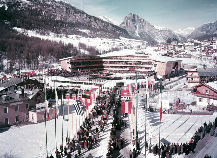 Spectators entering the ice stadium before the opening ceremony of the seventh Winter Olympic Games, in Cortina, Italy, on Jan. 26, 1956. (AP Photo)