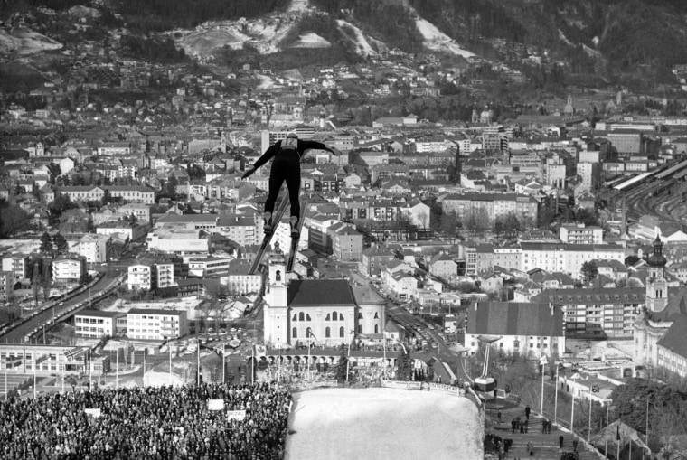 International ski jumping, Sunday, Jan. 4, 1976 in Innsbruck, Austria. The view of the Olympic city of Innsbruck; in front one of the competitors. (AP Photo/Henry Griffin)