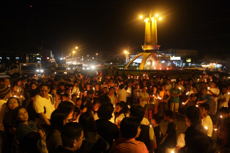 Image: Candles Lit For Victims of Philippine Massacre