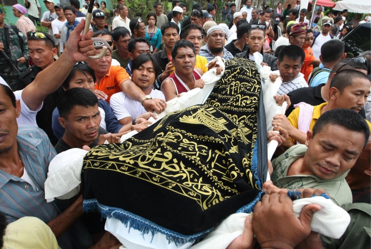 Image: Filipino Muslims hold burial rights for victims of pre-elections crime in southern Philippines
