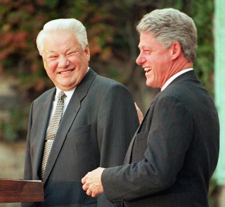 US President Bill Clinton (R) shown in a file phot