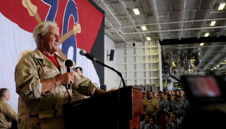 Former National Football League head coach Don Shula addresses the crew of aircraft carrier USS Ronald Reagan (CVN 76), under way in the Atlantic Ocean, July 13, 2009. Shula and other celebrities are visiting the ship as part of the United Service Organizations' Summer Troop Visit to thank service members for their service and to help boost their morale. The ship is deployed to the U.S. 5th Fleet area of operations. (U.S. Navy photo by Mass Communication Specialist 2nd Class Joseph M. Buliavac/Released)