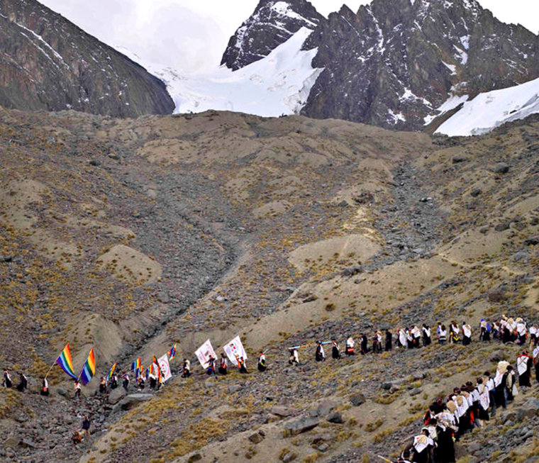 Since 2003, however, the ukukus no longer carry the ice down from Qolqepunku. \"We must protect the glacier,\" said one ukuku leader. Pilgrims have been banned from taking the sacred ice since this year. Those who are caught with the contraband ice are whipped by the ukukus, shown climbing the barren mountain above.