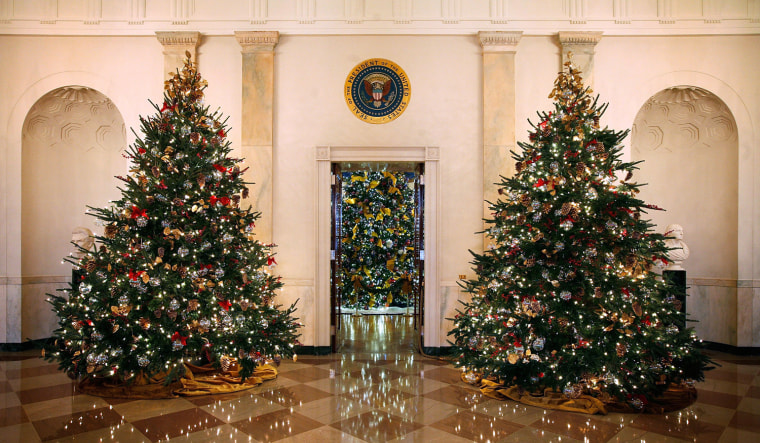 Image: Christmas trees stand on the State Floor at the White House