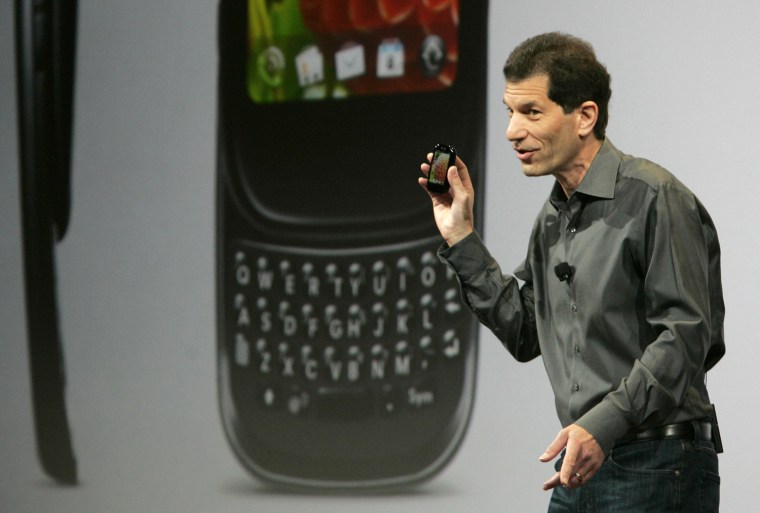 Image: Rubinstein, chairman and CEO of Palm, holds a new Palm phone during a news conference at the CES in Las Vegas