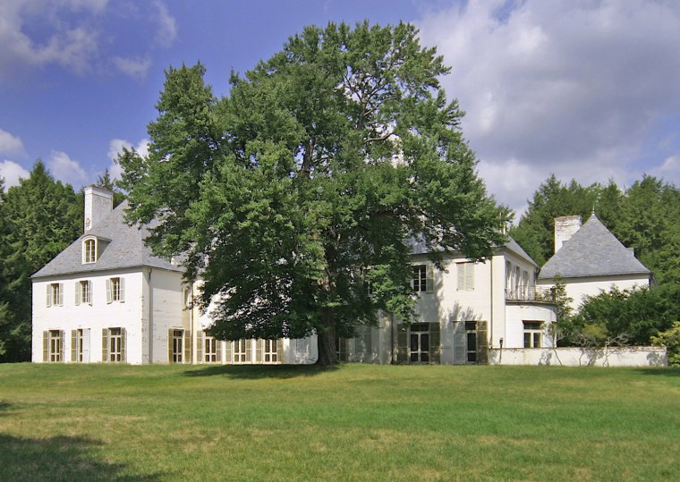 Absolute privacy of Le Beau Château, the Clark estate in New Canaan, Conn. The house at 104 Dan's Highway cannot be seen from the road. Nearby residents of New Canaan include singer-songwriter Paul Simon and pianist-actor Harry Connick, Jr. It's an hour's drive to Manhattan.