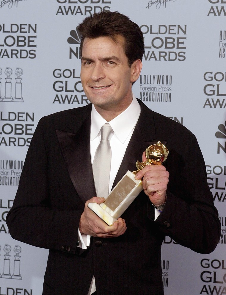 US actor Charlie Sheen poses with his Golden Globe